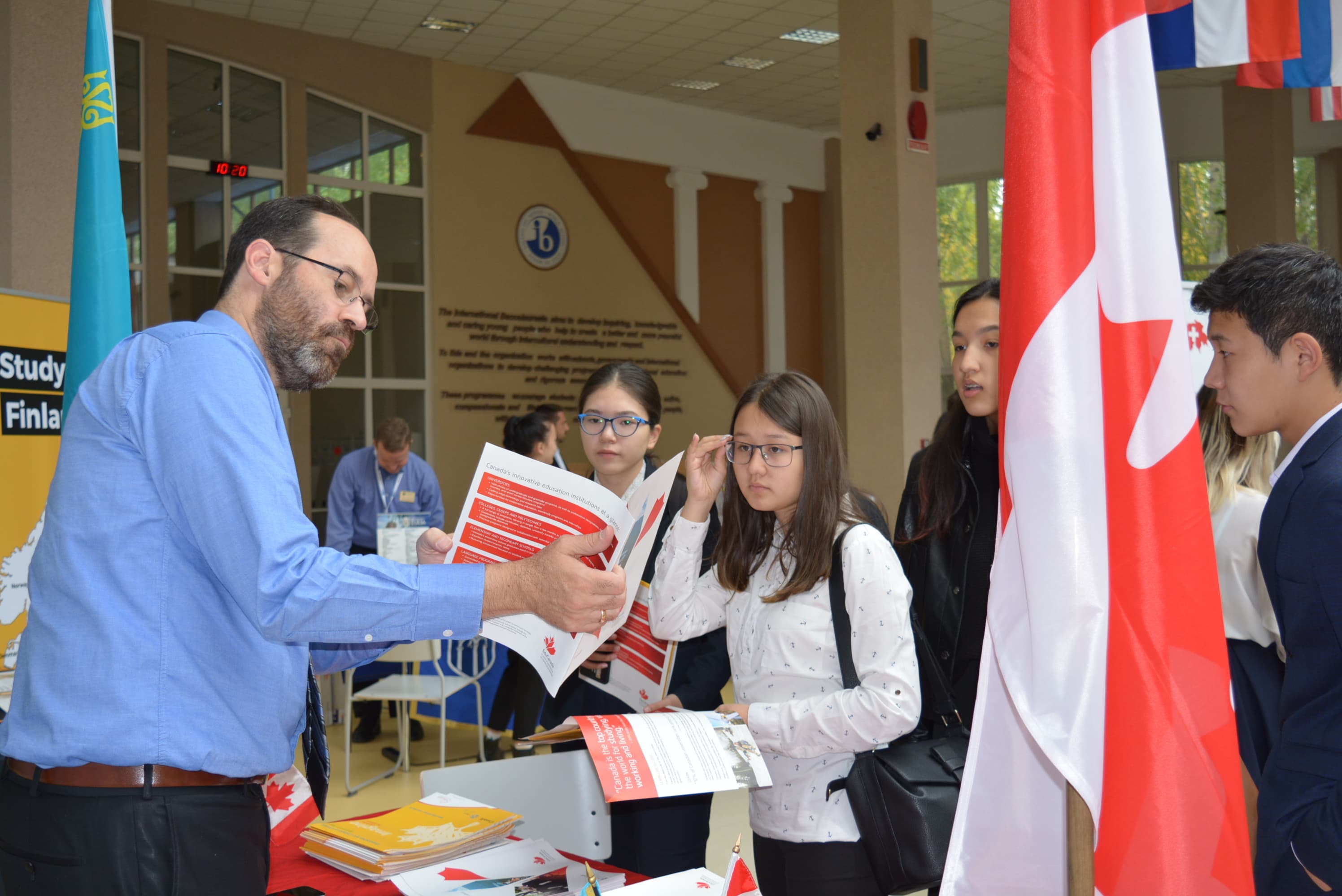 Students at Miras International School engaging in university education fair